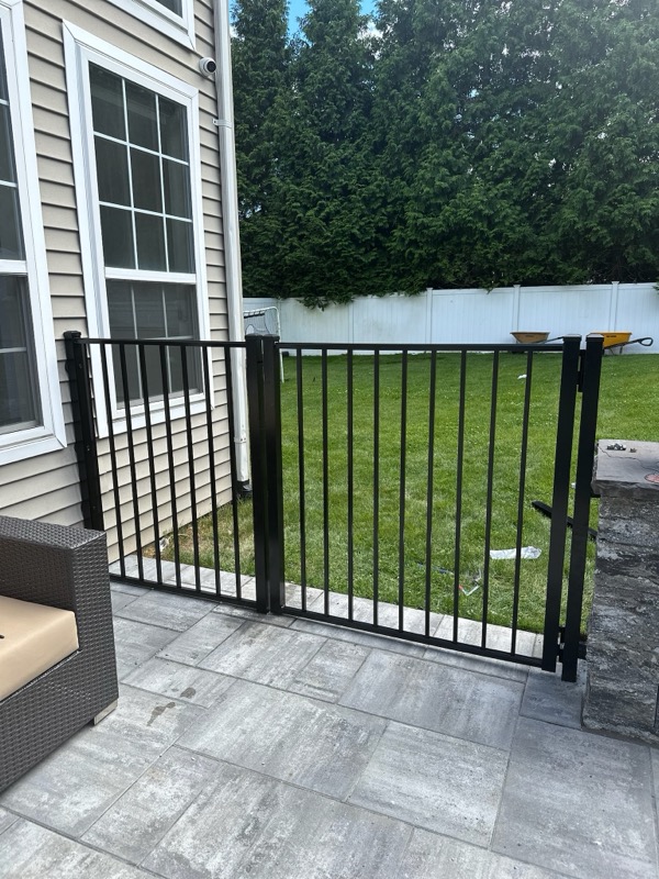 Paver patio with iron fencing in Blue Point, NY